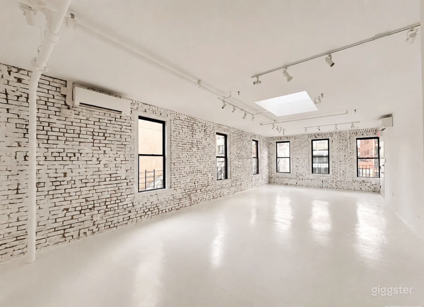 Artistic All-White Loft with Walls of Windows
