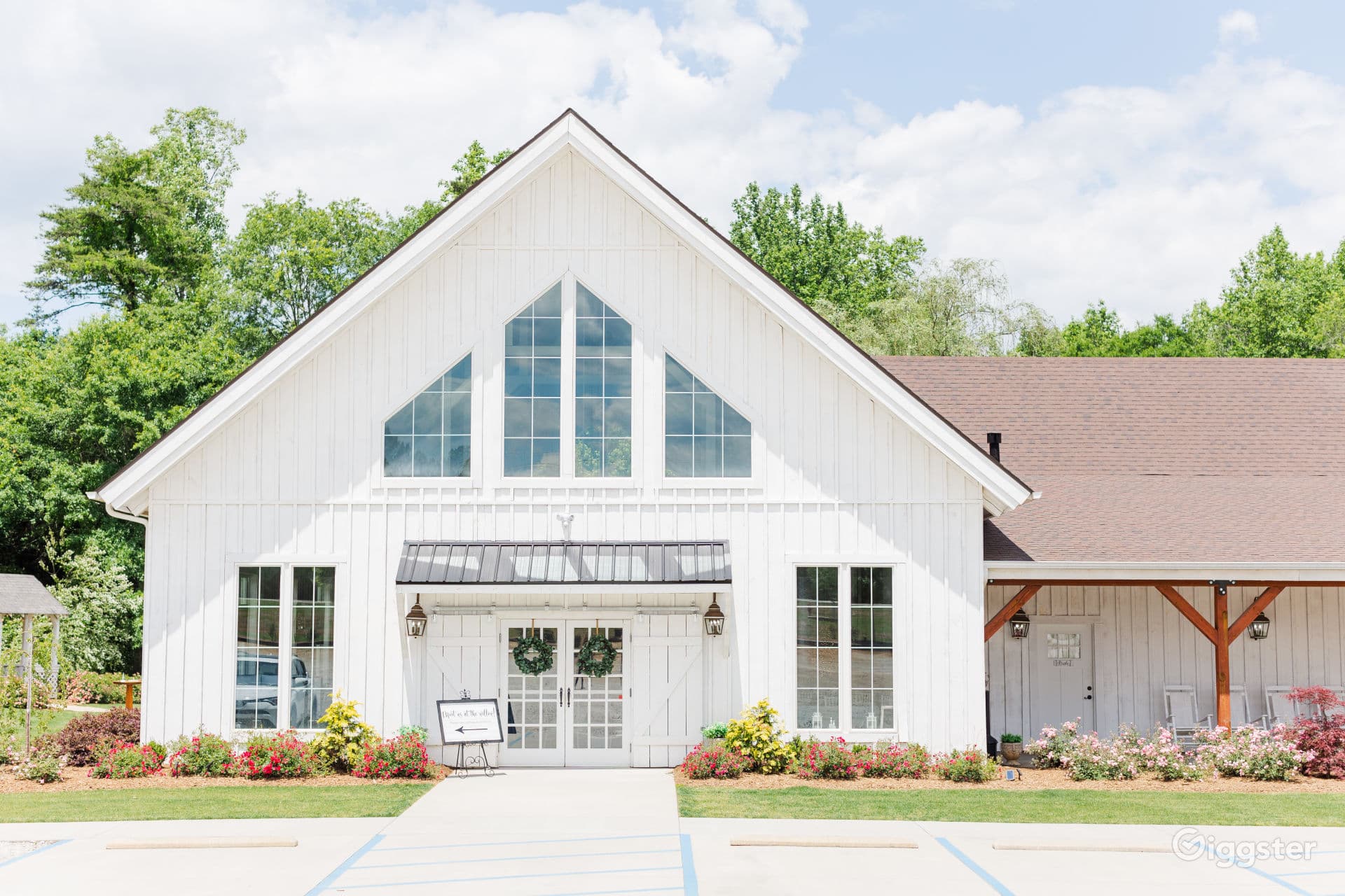 An all-white post-and-beam wedding & event venue, Taylors