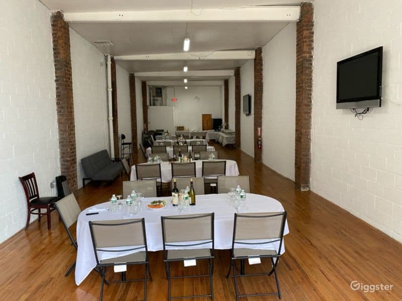Raw multi-use space, exposed brick, high ceilings.